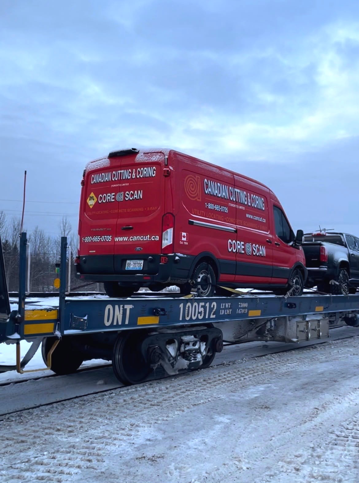 Canadian Cutting & Coring CORE SCAN van loaded on an Ontario Northland railcar, ready to mobilize across the province